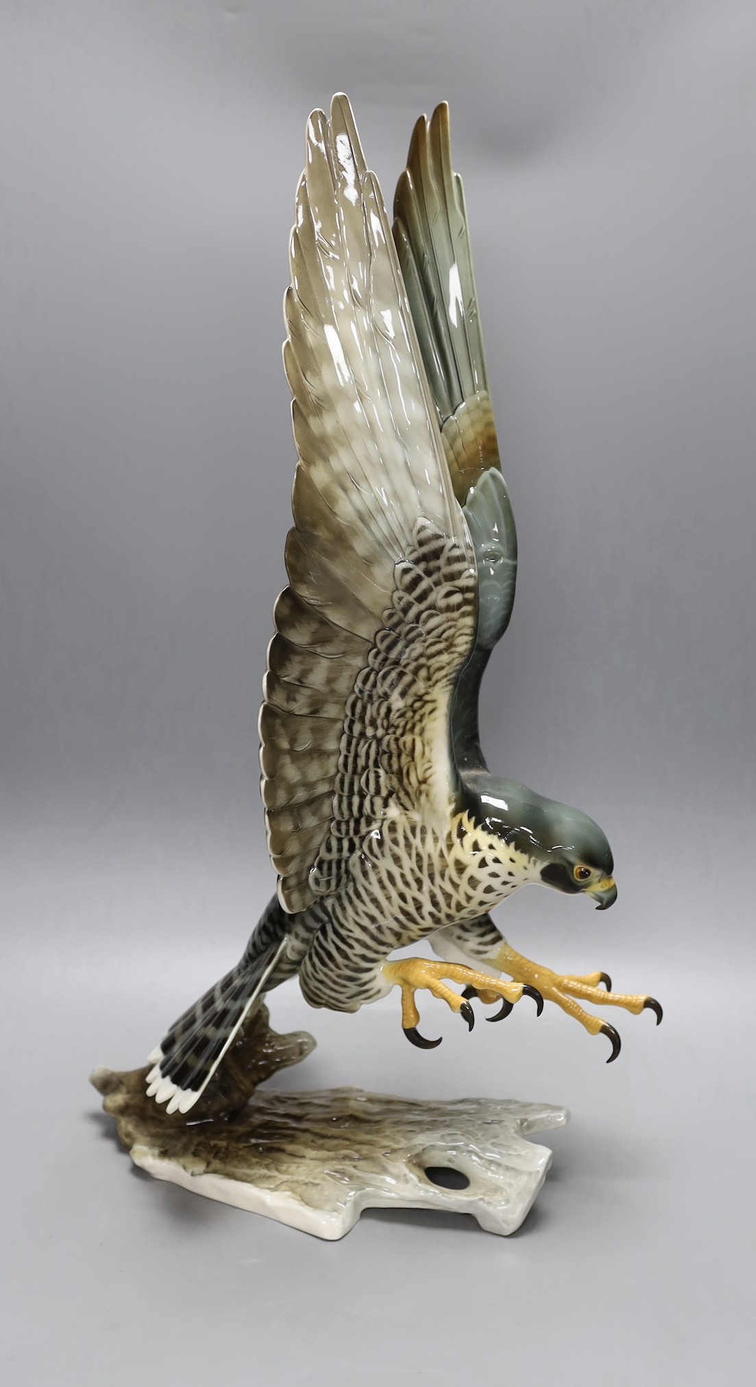 A large Hutschenreuther porcelain Peregrine falcon, 59cm